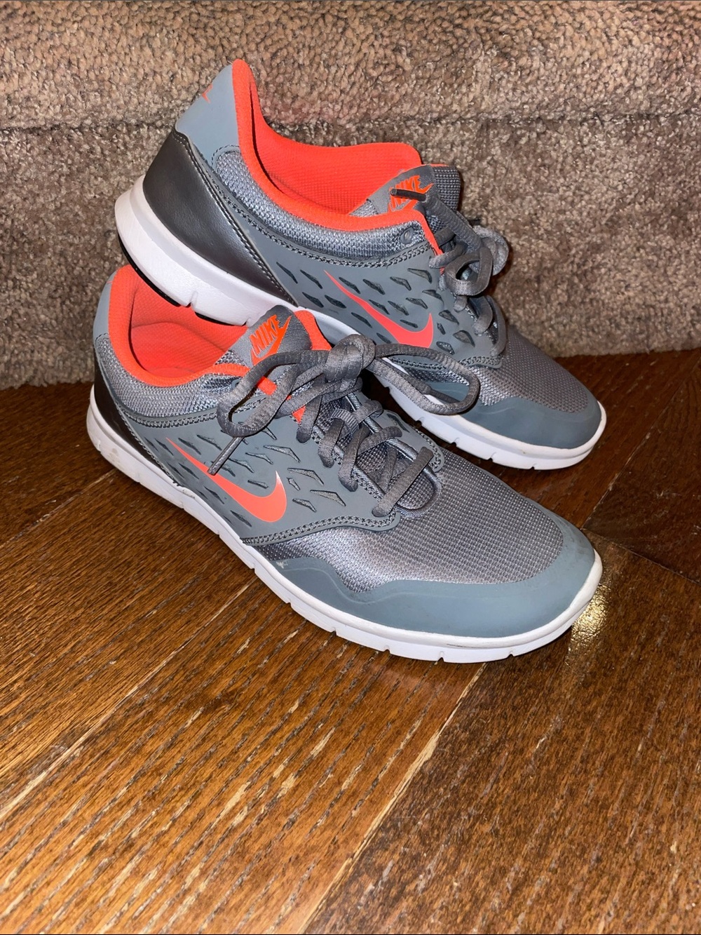 Nike Gray Sneakers with Bright Orange Accents